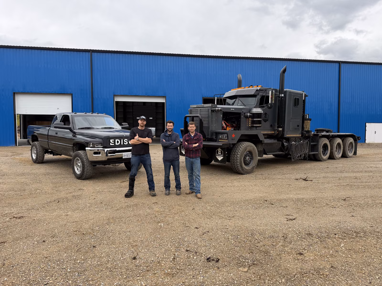 The Edison Motors crew with Big D and an Edison pickup outside the shop