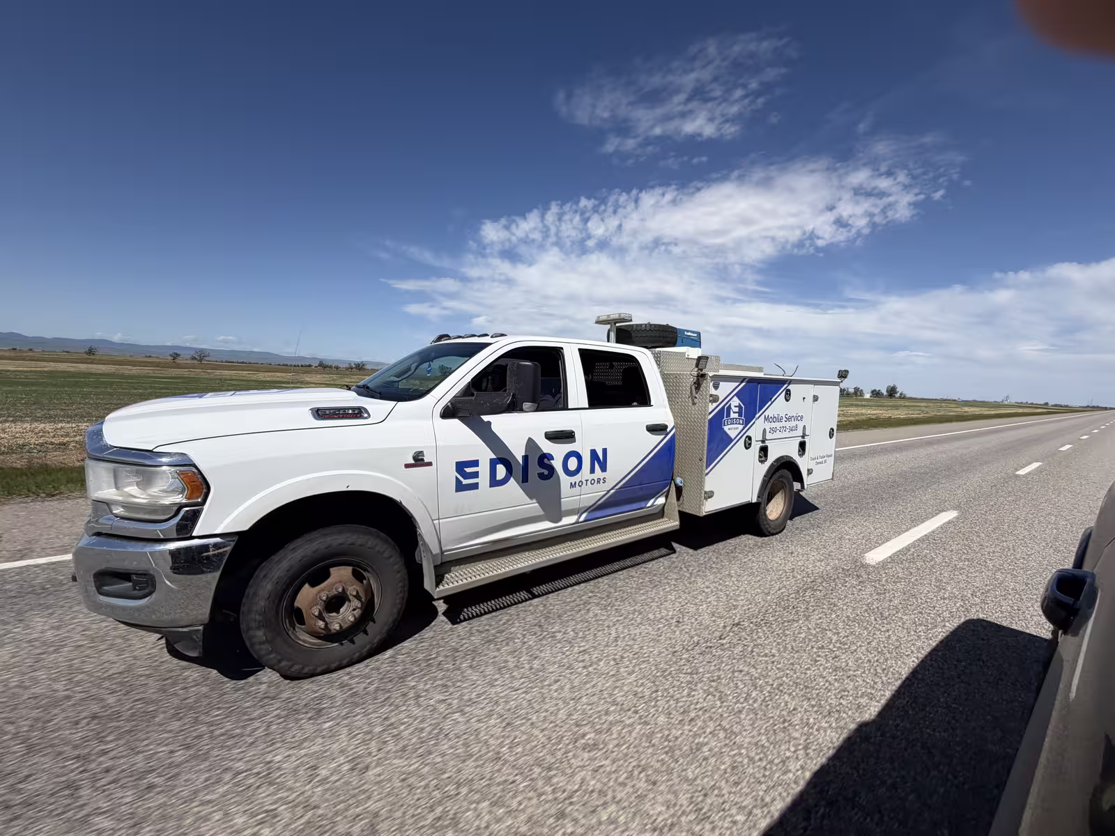 Edison Motors mobile service truck driving on the highway